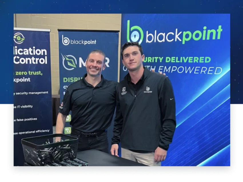 blackpoint-cyber-team-at-event-booth-2023-300x225.png