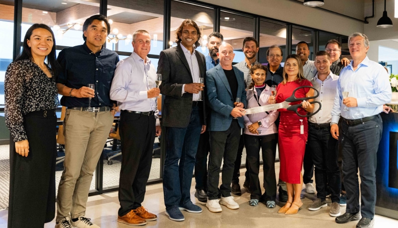 Blackpoint Cyber team in the new Denver office cutting ribbon